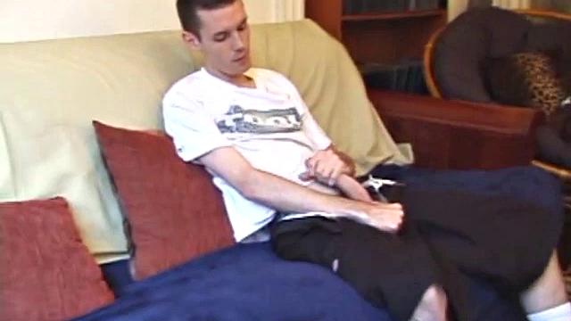 When his cock is hard enough, Logan unzips and out pops his huge boner. He gives it a serious stroking, edging himself a few times. When it's finally time to release, he explodes a massive cum load onto his face and chest.