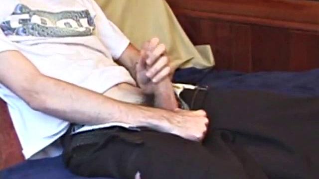 When his cock is hard enough, Logan unzips and out pops his huge boner. He gives it a serious stroking, edging himself a few times. When it's finally time to release, he explodes a massive cum load onto his face and chest.