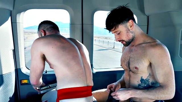 Fisting tattooed jock in gloves fists BF in bus