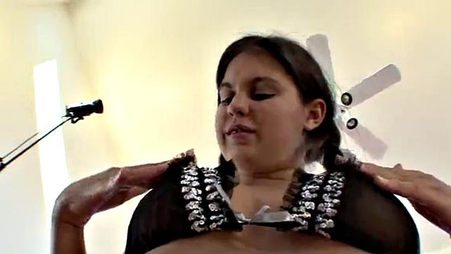 Brunette teen rubs her pussy