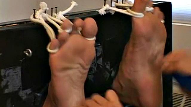 dude thinks he's safe with his socks on until his buddy proves ticklish feet are fair game