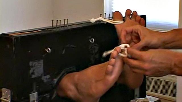 dude thinks he's safe with his socks on until his buddy proves ticklish feet are fair game