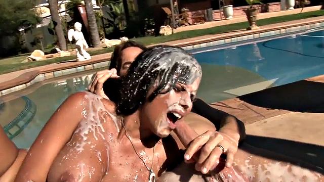 Watch Diamond Kitty's oiled-up pussy get pounded and covered in jizz