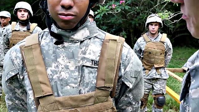 A muscular ebony soldier suck before getting fucked in an interracial group