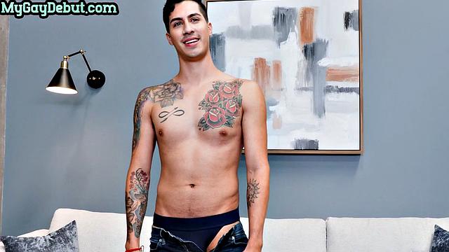 Tattooed skinny jock tugging dick