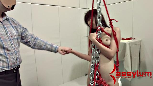 A kinky teen get dominated and face fucked while bound and wearing a mask