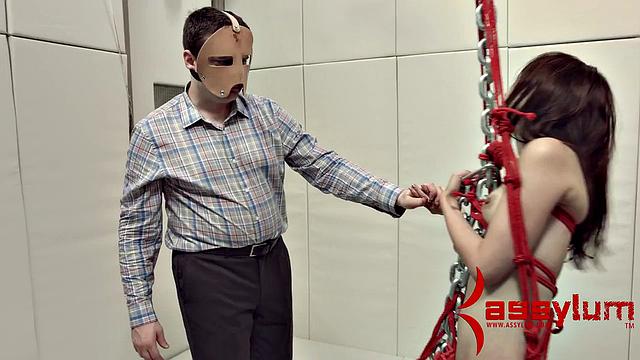 A kinky teen get dominated and face fucked while bound and wearing a mask