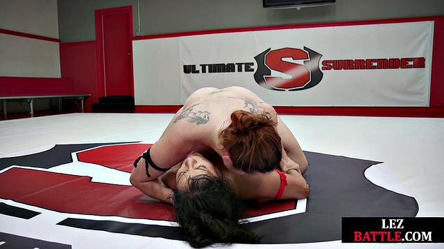 Redhead wrestler dominates rival