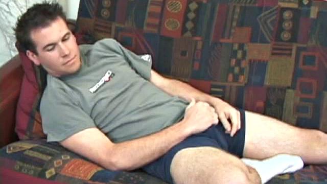 New comer pops in a porn video and slides his hands down his pants. He rubs his dick through his blue boxers, until it's stiff and ready to action. Then starts stroking his boner with determination until it releases its load.