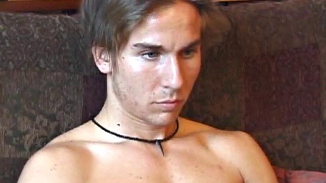 Stripped and Tuned Into a Porn Video, Scruffy Brock Strokes his Stiff Cock