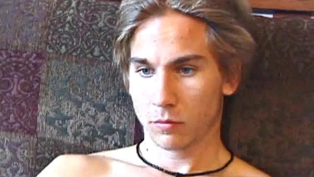 Stripped and Tuned Into a Porn Video, Scruffy Brock Strokes his Stiff Cock