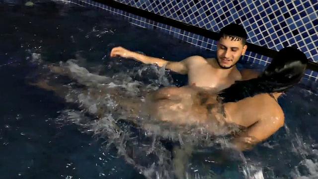 Voluptuous Sabrina Sousa and a Guy Make Out in a Swimming Pool