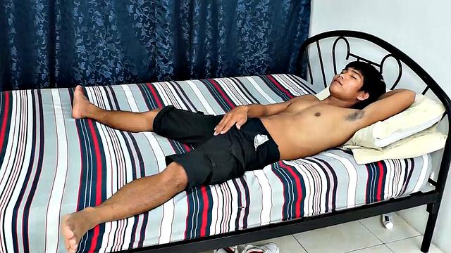 Jesse Rivera goes solo to show off his wide Asian boy feet. He's wearing white Nike's and watch him strip off and give a little self-tickle.