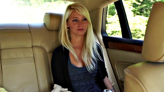 Girl leans out car window to suck