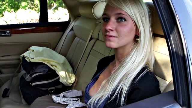 Girl leans out car window to suck