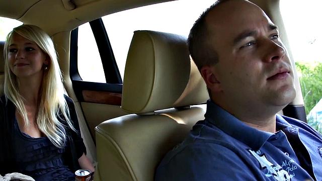 Girl leans out car window to suck