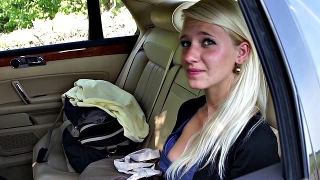 Girl leans out car window to suck