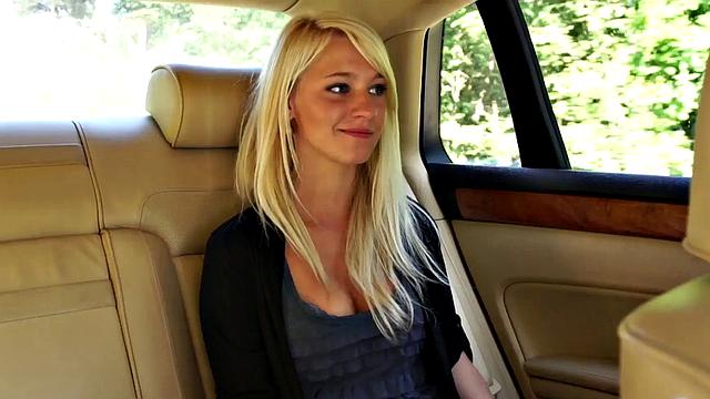 Girl leans out car window to suck