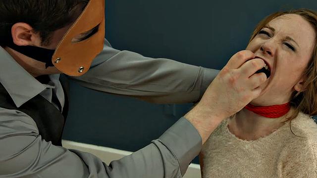 Rope-bound slut gagging on toy