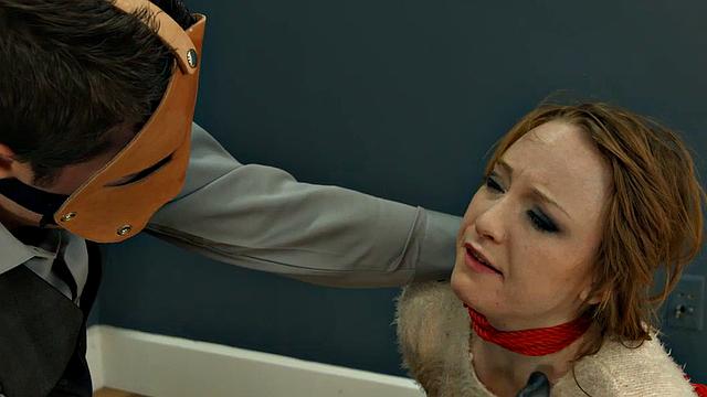 Rope-bound slut gagging on toy