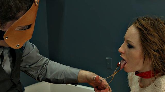 Rope-bound slut gagging on toy