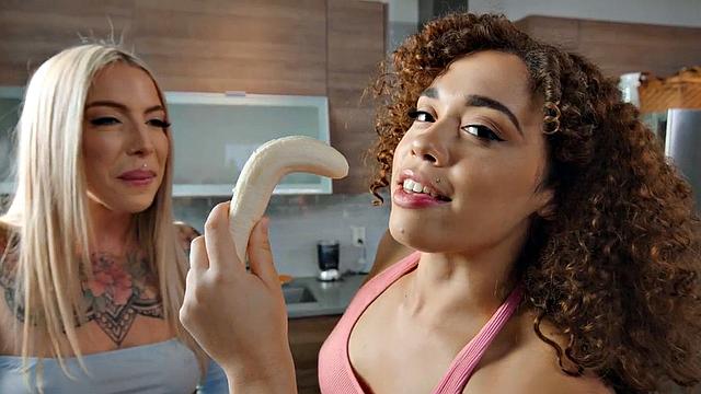 Big booty lesbians play in kitchen with banana