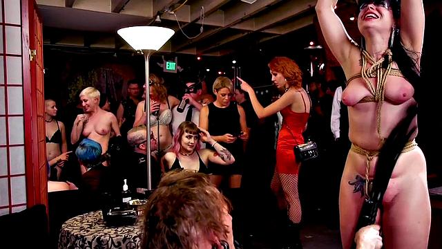 BDSM submissive lady whipped in public in front of voyeurs