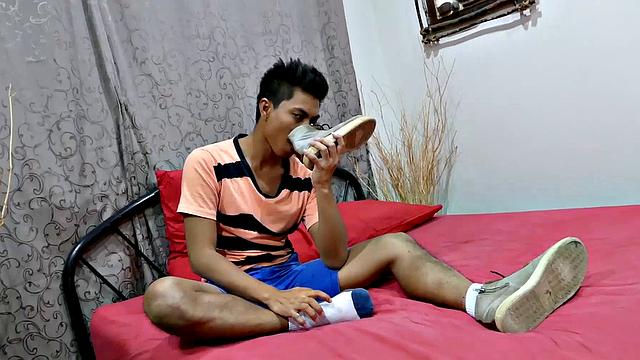 This horny Asian boy has some of the hottest soles you ever see. Watch Josh slide his shoes off, inhale the sweet foot aroma, and caress his boy feet as he gets turned on.