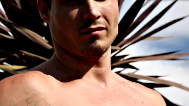 A tattooed hunk stroke his cock in the office with his pecker out