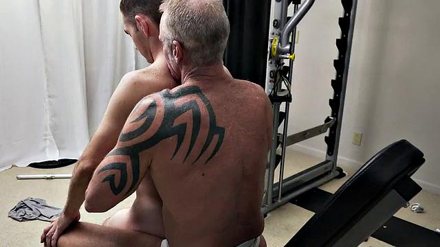 Tiny gym twink bareback fucked by muscled gay DILF