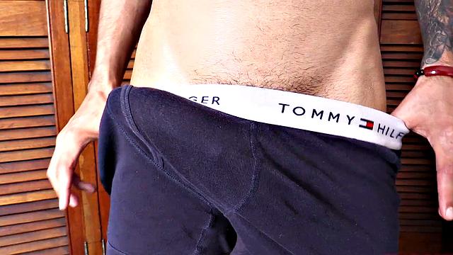 We find Dante stripped to his underwear and already sporting a big boner. He pulls that big cock out and plays, before getting totally naked. A long stroke follows, as this slim and smooth young man jerks off all over the room.