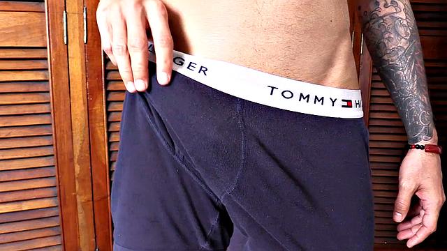 We find Dante stripped to his underwear and already sporting a big boner. He pulls that big cock out and plays, before getting totally naked. A long stroke follows, as this slim and smooth young man jerks off all over the room.