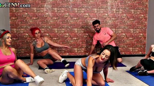 CFNM yoga femdoms give group handjob to man in class