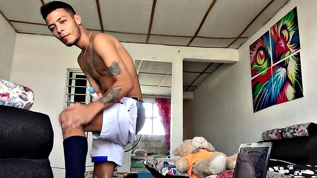 Skinny inked Latino strips and masturbates in solo