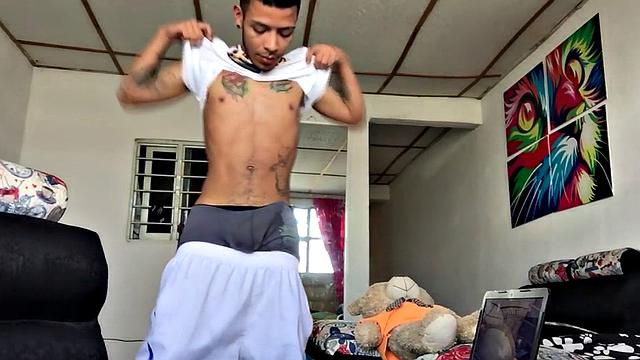 Skinny inked Latino strips and masturbates in solo