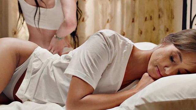 Busty TS babe licks and deepthroats babe in bed