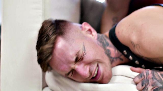 Inked jock blows muscled top before bareback sex