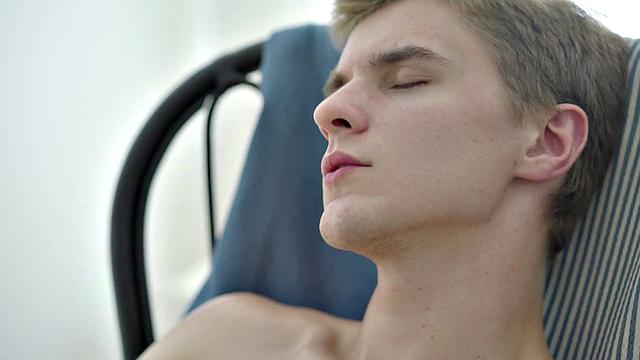 A slim guy with a big dick oil up his tight ass before jerking off and cumming