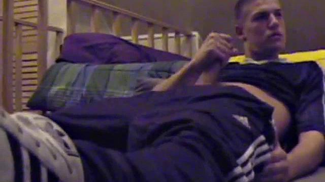 Lance pops in a porn video and pulls out his hard cock. He starts a long stroke show, getting himself close to cumming several times. Once past the point of no return, he pumps out a warm cum load onto his tummy.