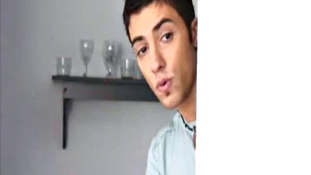 Niko Tomiar and Oscar Blanco are relaxing on the couch. Niko is with curly black hair and big white smile. Oscar knows it, too. He starts rubbing all over Niko as the two kiss.