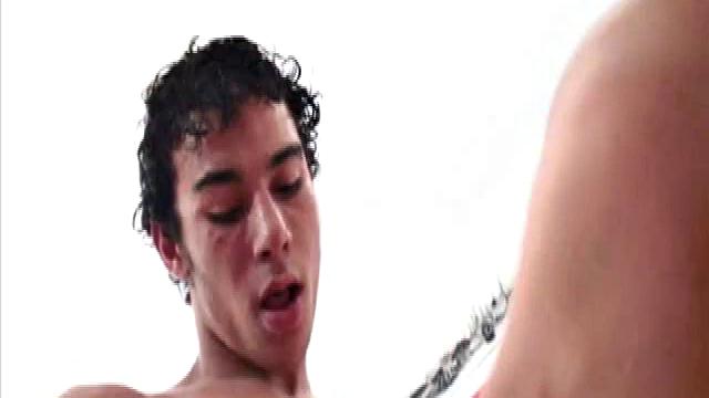 Niko Tomiar and Oscar Blanco are relaxing on the couch. Niko is with curly black hair and big white smile. Oscar knows it, too. He starts rubbing all over Niko as the two kiss.