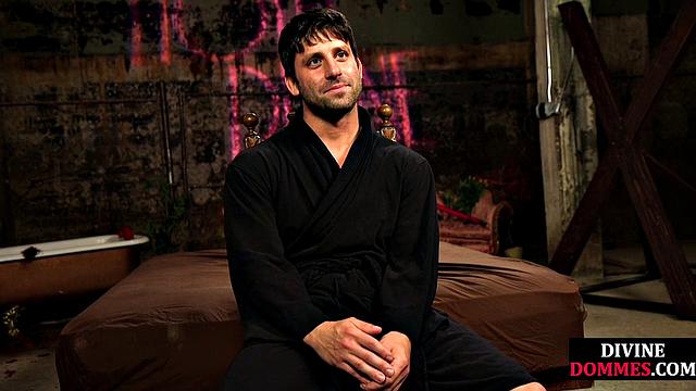 Busty latex femina dominates male using huge toy