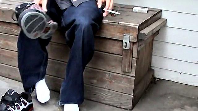 Ian Madrox kicks back outdoors and gives his feet more attention than his last boyfriend