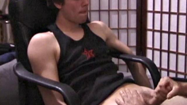 Kicking back in a chair, Jayden is ready to jack off again, and we get to watch! This time he enjoys some help from a mystery hand that edges out his cum.