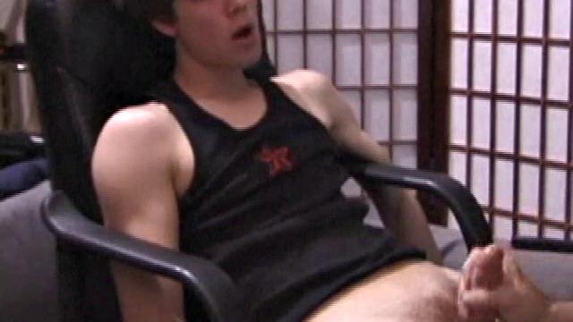 Kicking back in a chair, Jayden is ready to jack off again, and we get to watch! This time he enjoys some help from a mystery hand that edges out his cum.