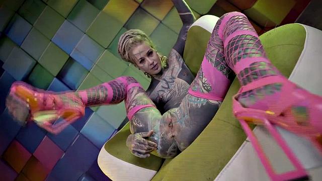 Heavily Tattooed Teen Stretching