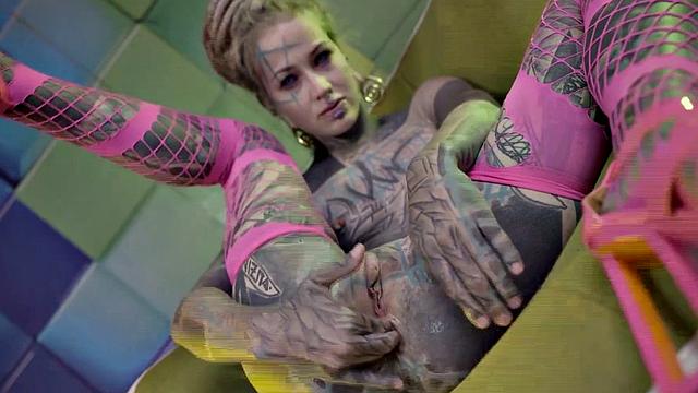 Heavily Tattooed Teen Stretching