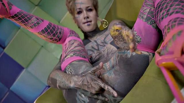 Heavily Tattooed Teen Stretching