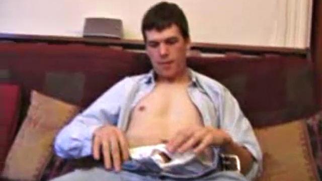 After hanging out with friends for the afternoon, Matthew finds himself on the couch with a raging boner and no one to help. So, he throws in a porn, sticks a hand down his pants and starts playing with himself.