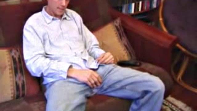 After hanging out with friends for the afternoon, Matthew finds himself on the couch with a raging boner and no one to help. So, he throws in a porn, sticks a hand down his pants and starts playing with himself.